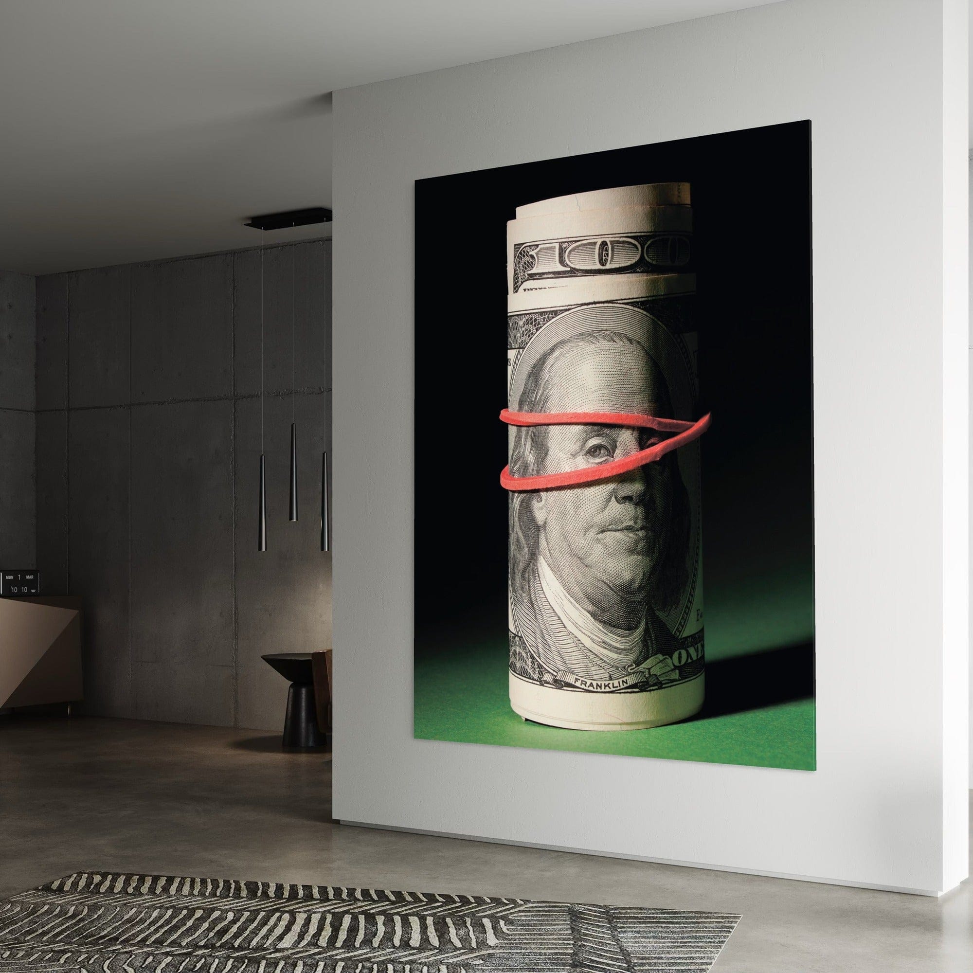 Framed money themed artwork displayed above contemporary desk setup
