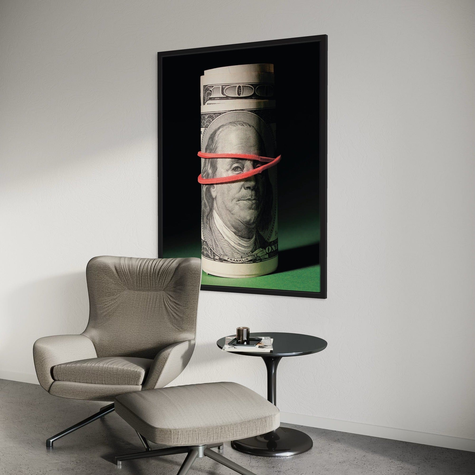Large money canvas art showing scale above modern office workspace