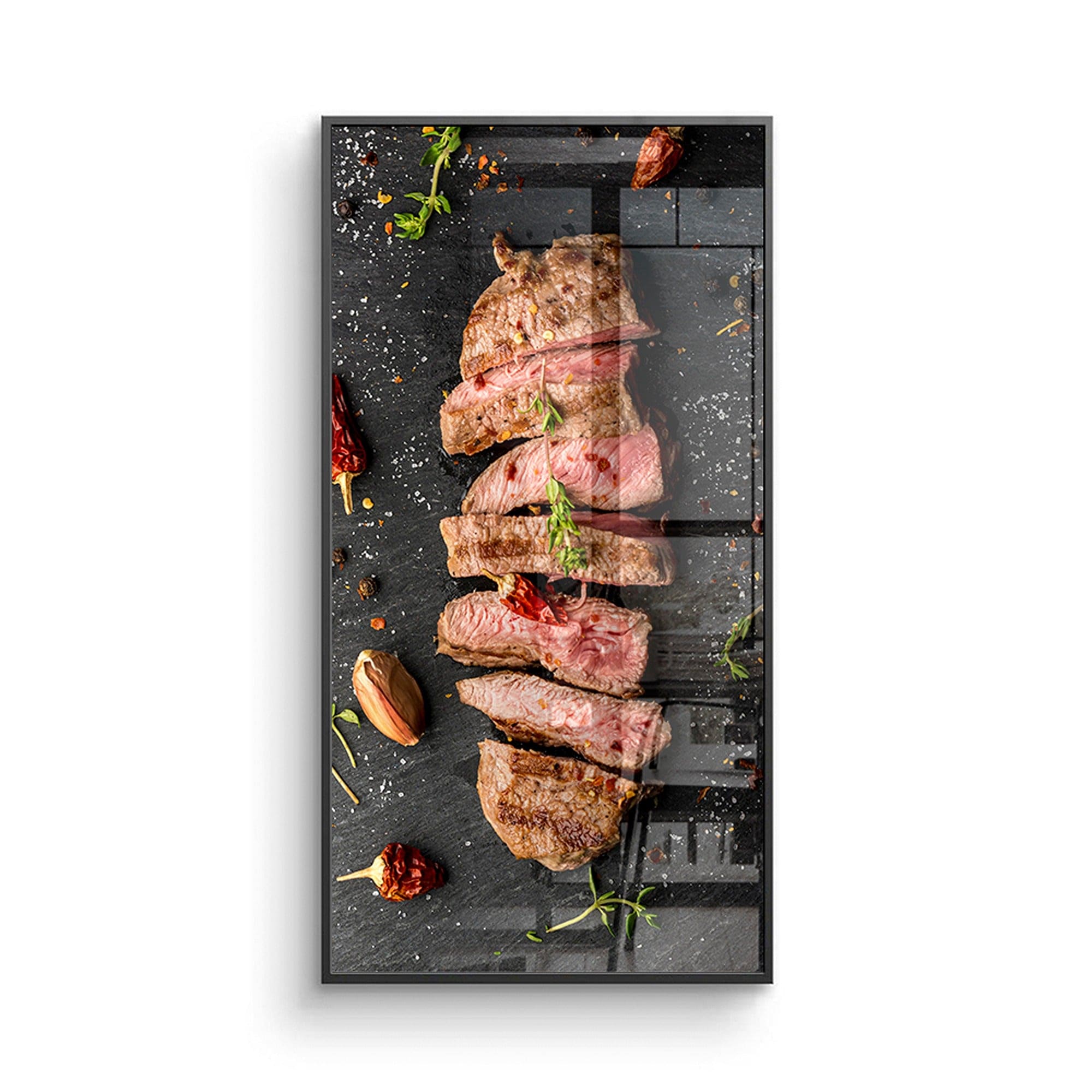 Sliced medium rare steak on slate poster