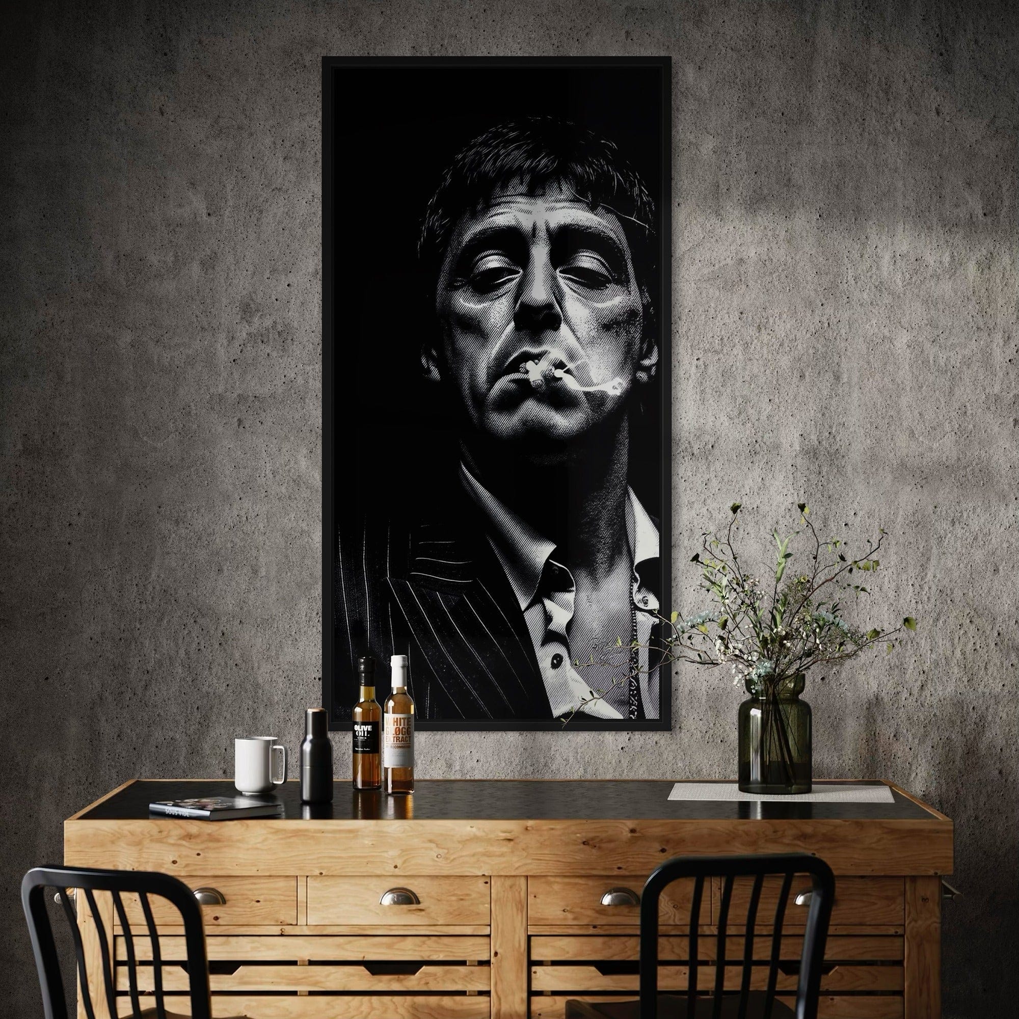 Poster of a man smoking on a wall above a wooden desk with decor items.