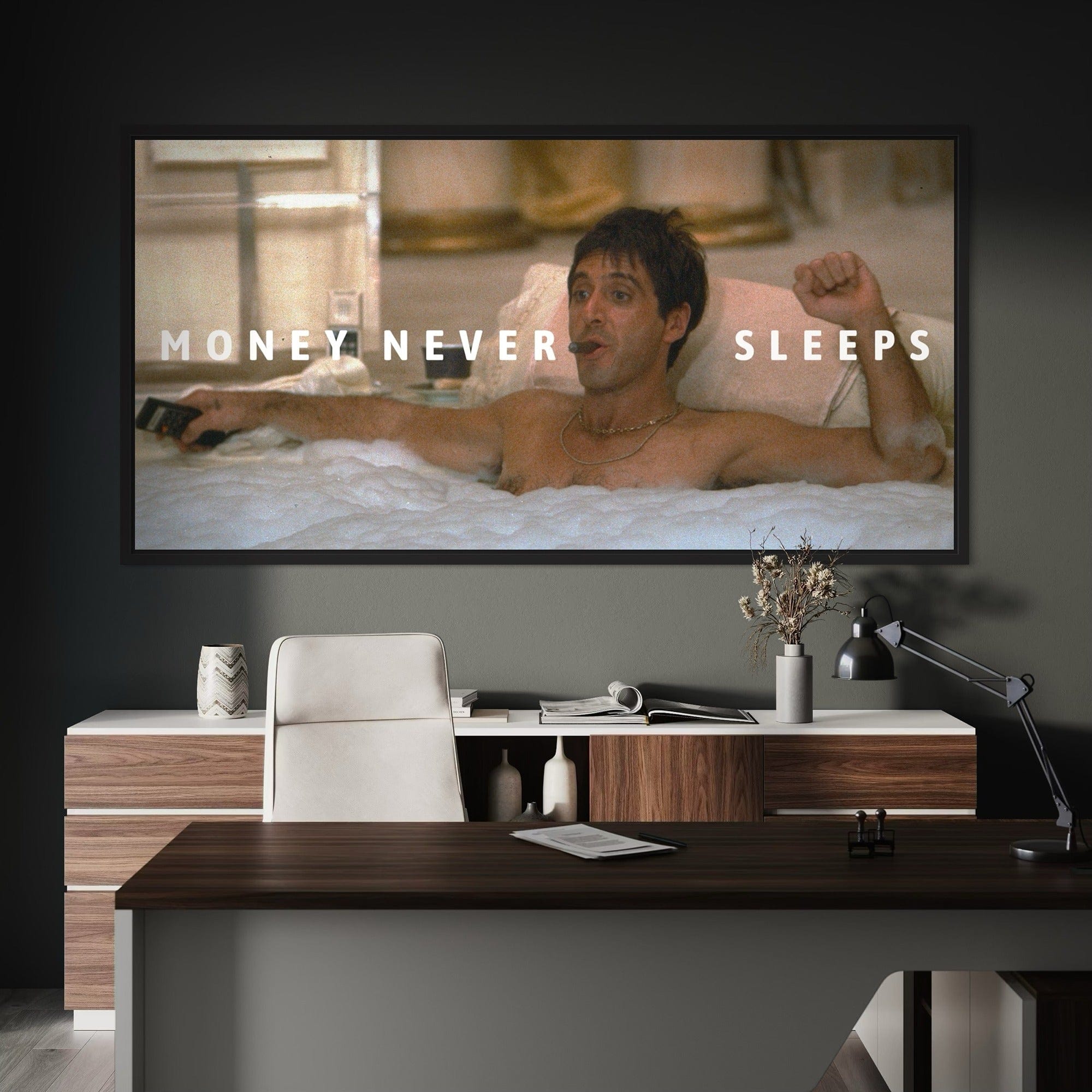 Tony Montana money never sleeps canvas wall art print - Man in a bathtub with 'Money Never Sleeps' text on a wall in a modern office setting