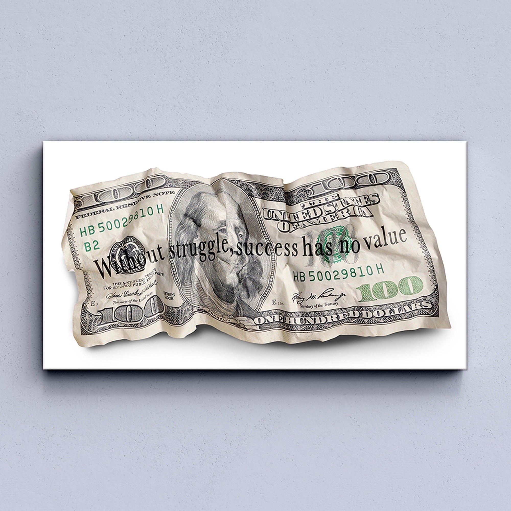 Wrinkled $100 bill with motivational text on a white background