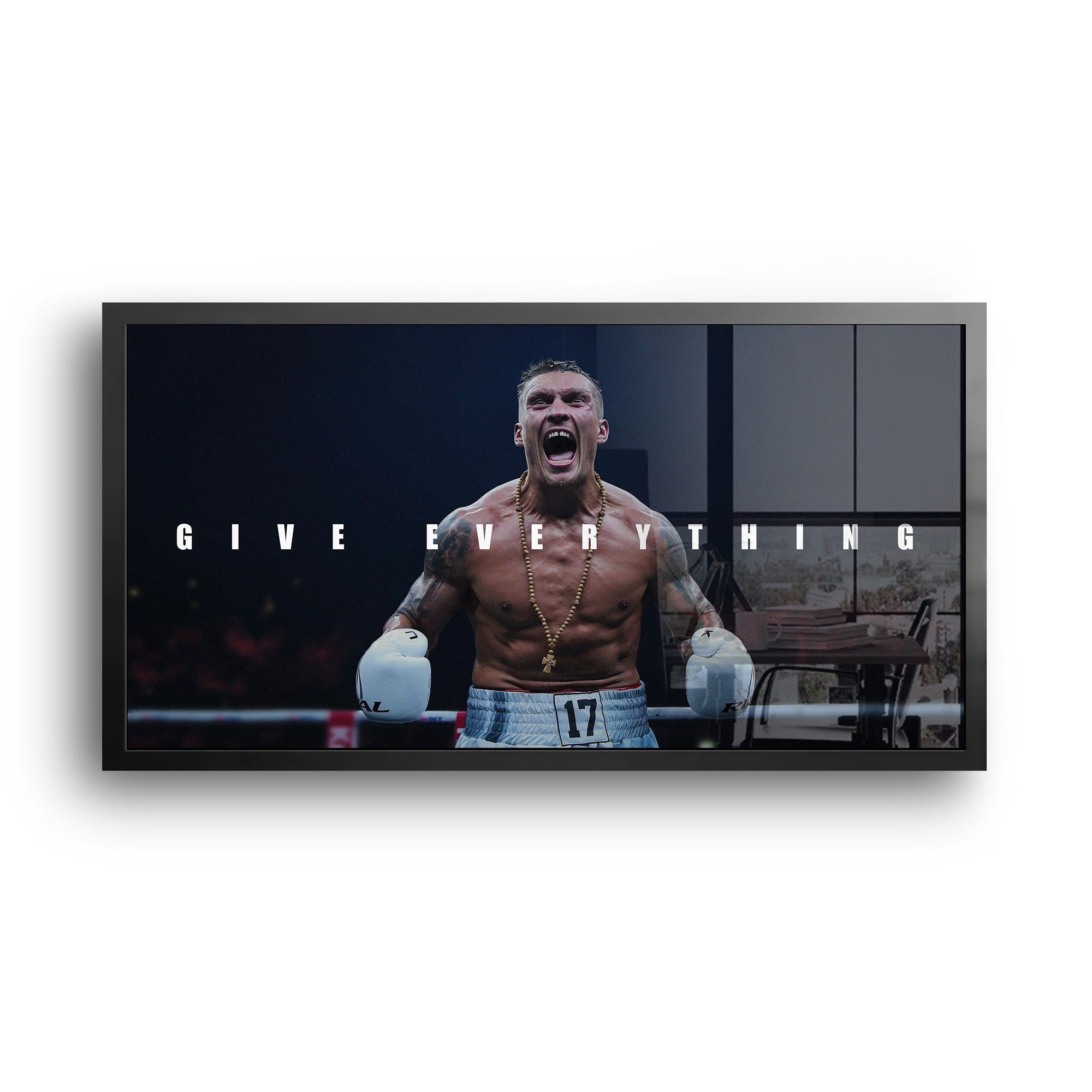 Framed boxing motivation artwork Oleksandr Usyk displayed in modern home gym interior