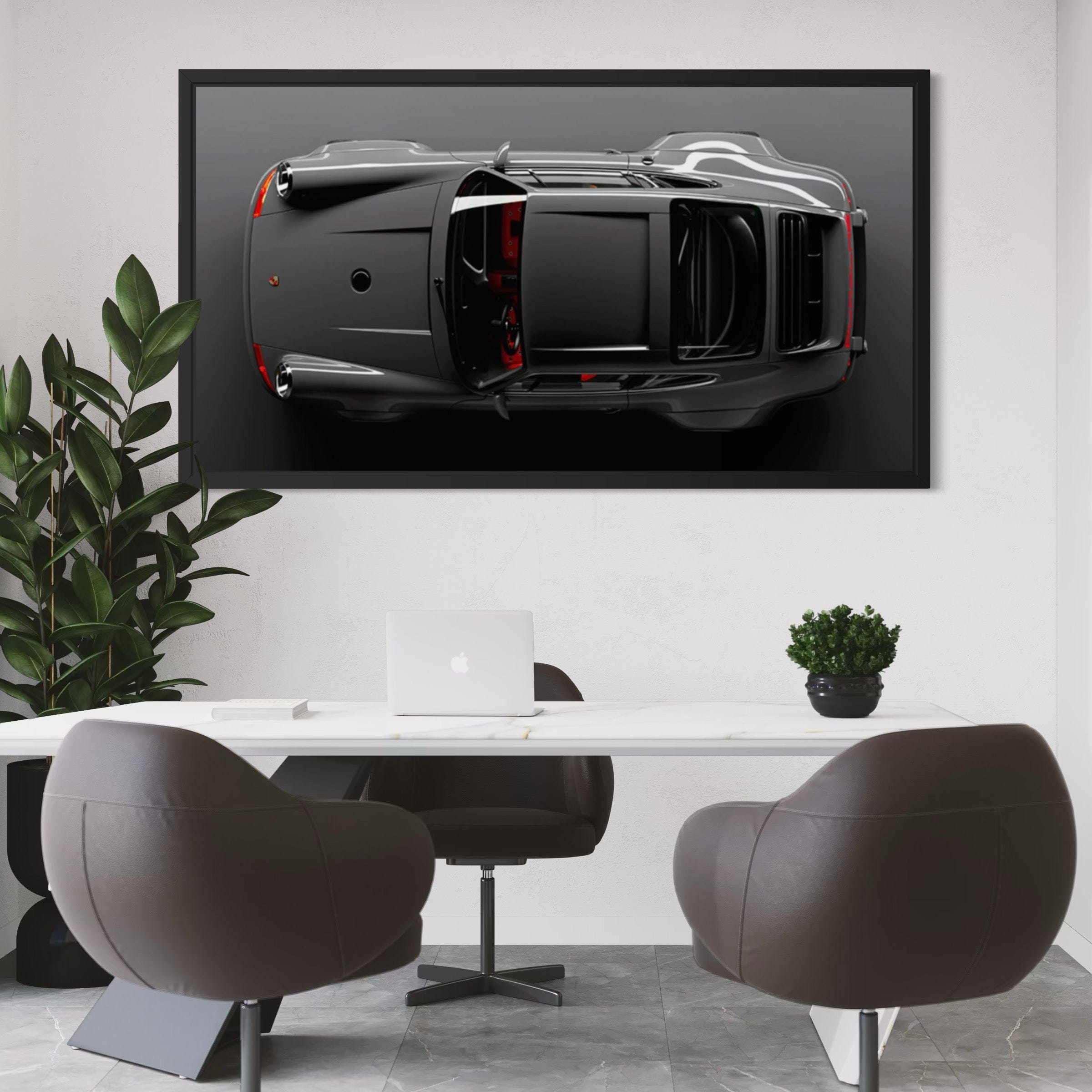 Modern office interior with a framed car artwork on the wall.