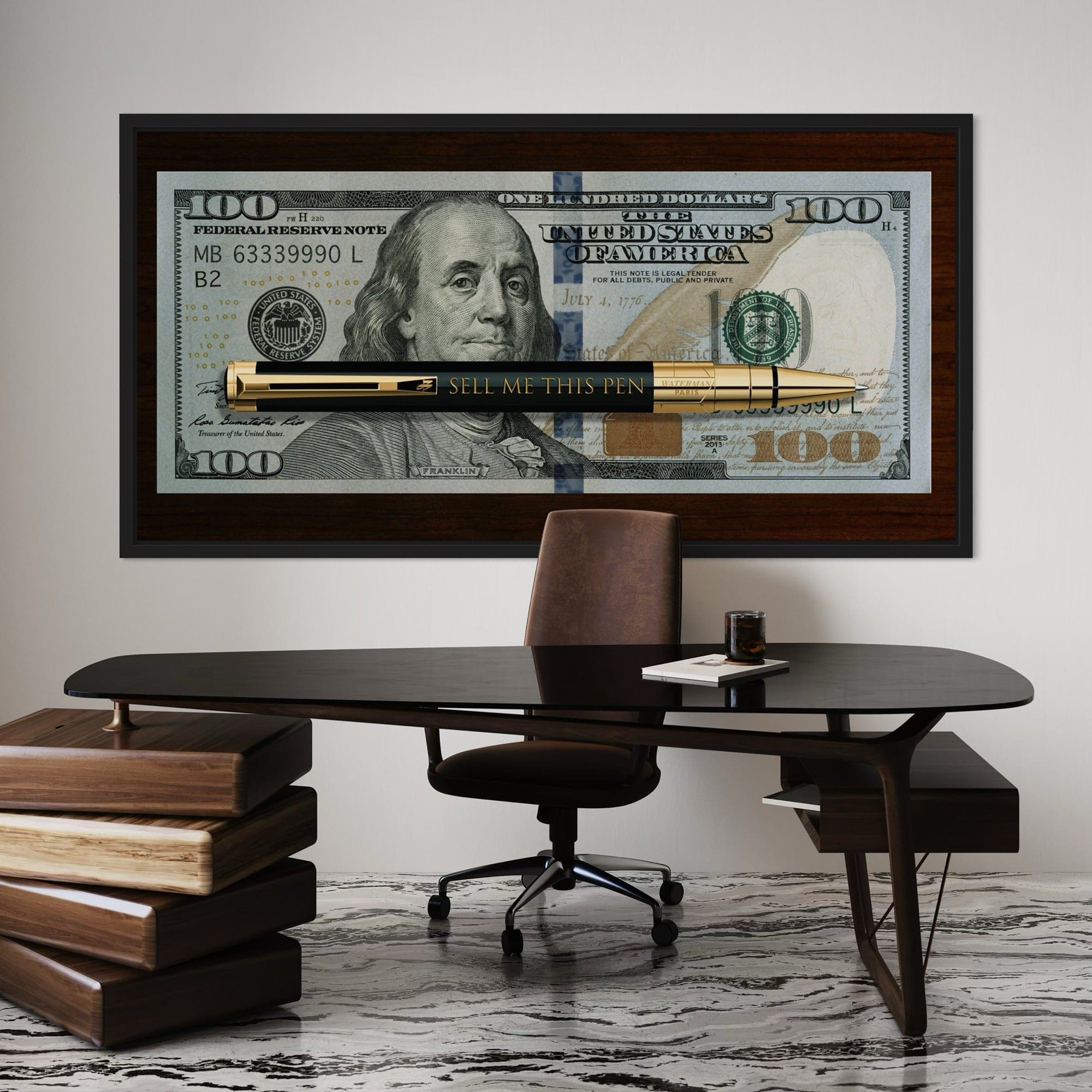 Framed sales motivation artwork displayed above contemporary desk setup