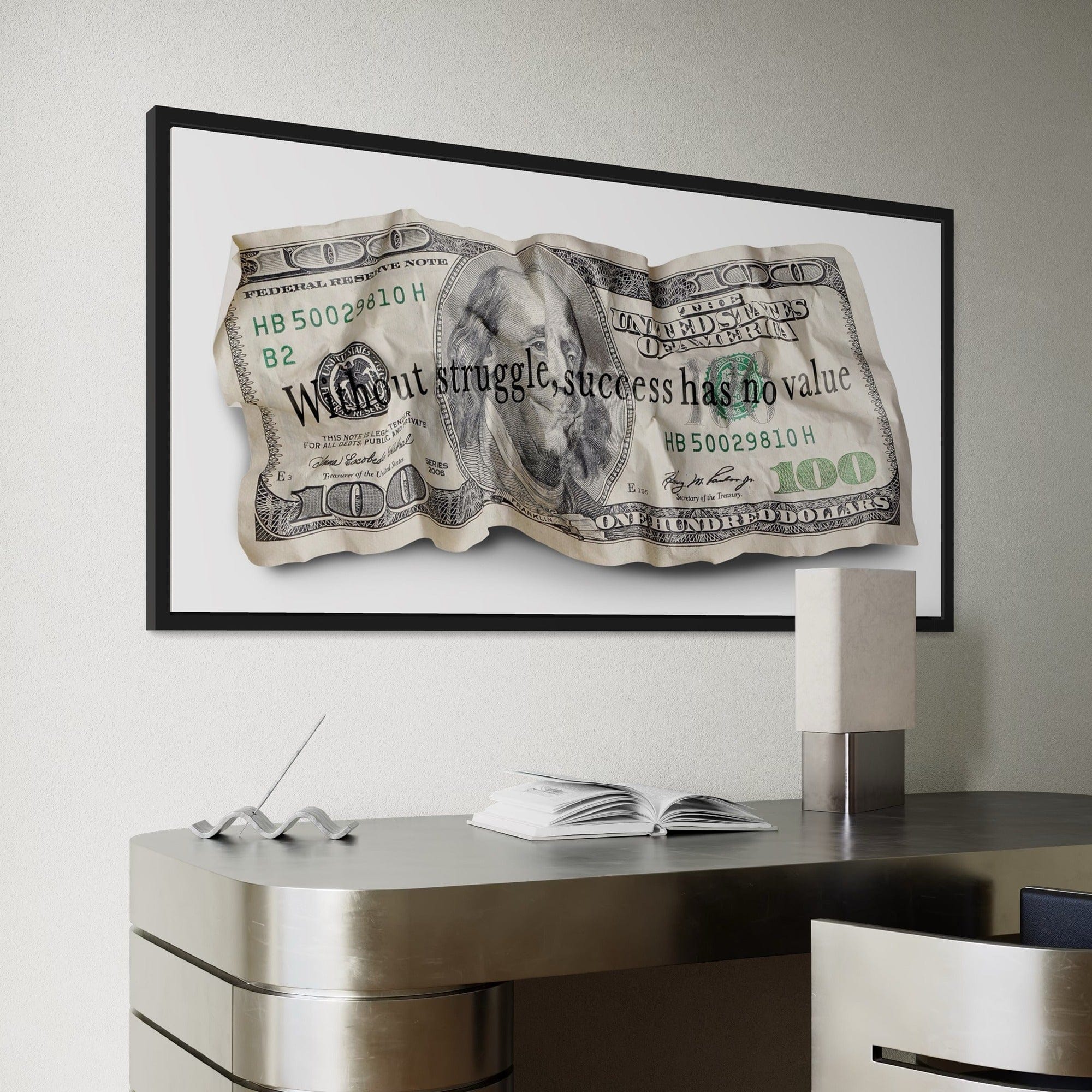 Framed dollar bill artwork on a wall above a desk