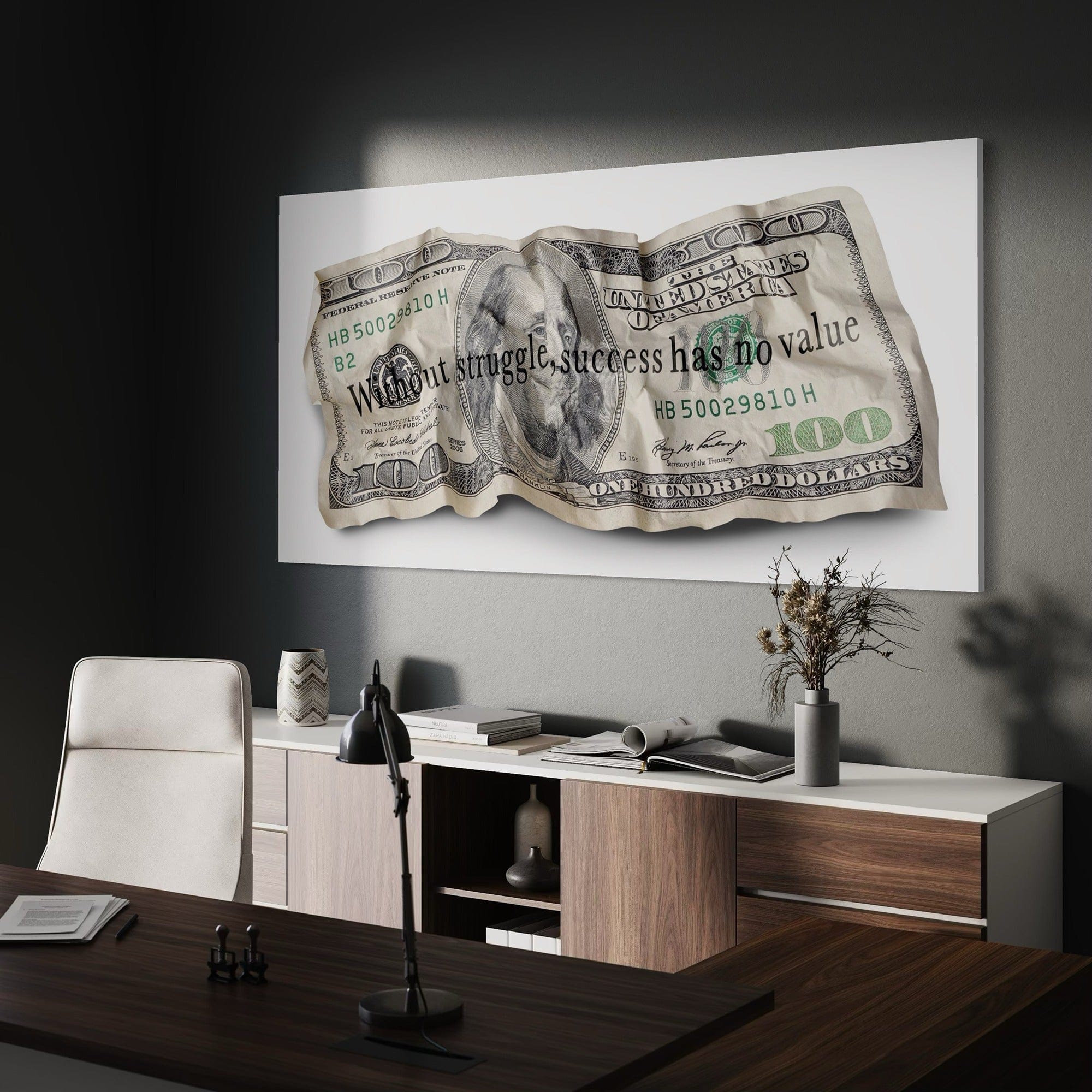 Modern office interior with a large framed dollar bill artwork on the wall.