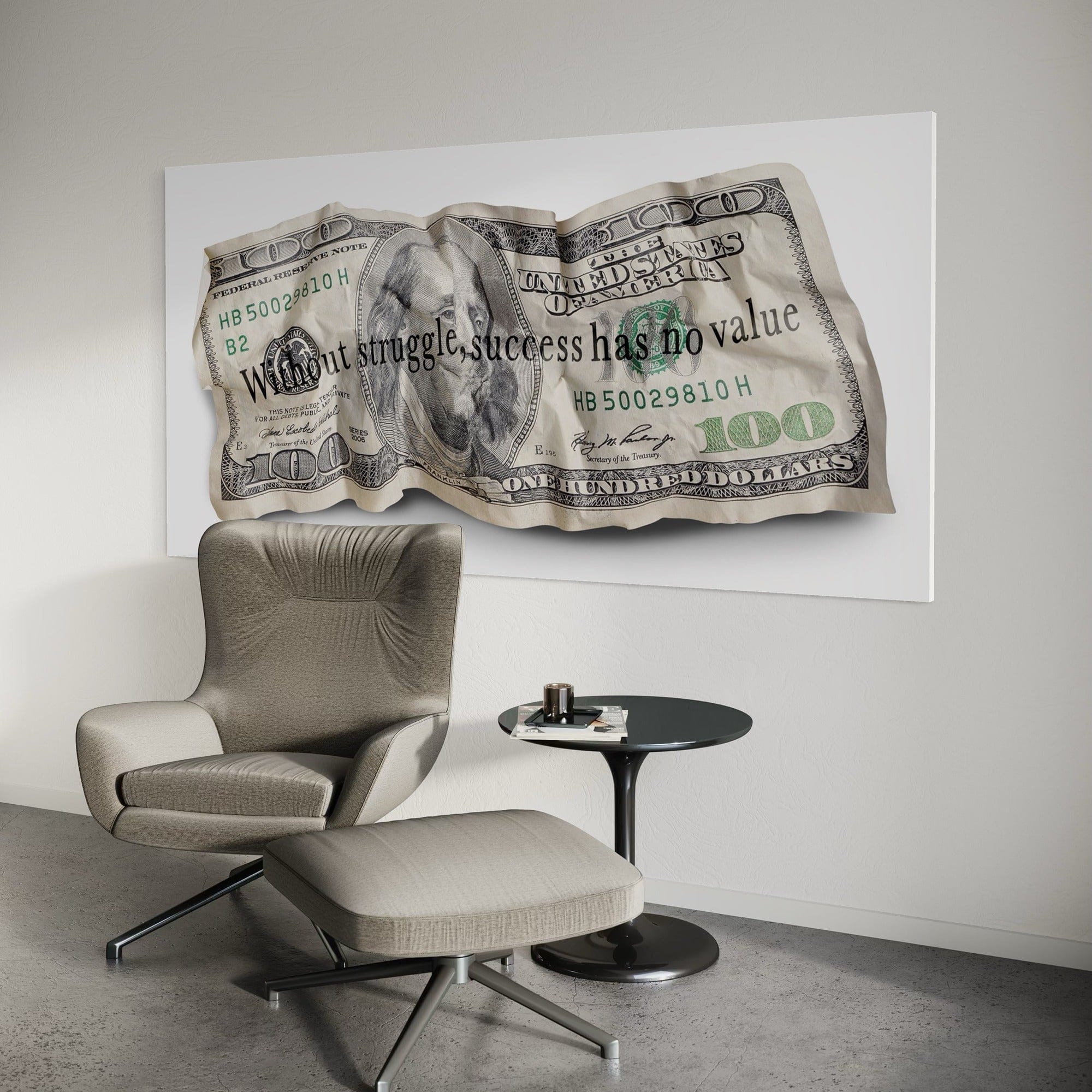 Chair and ottoman in a room with a large dollar bill artwork on the wall.